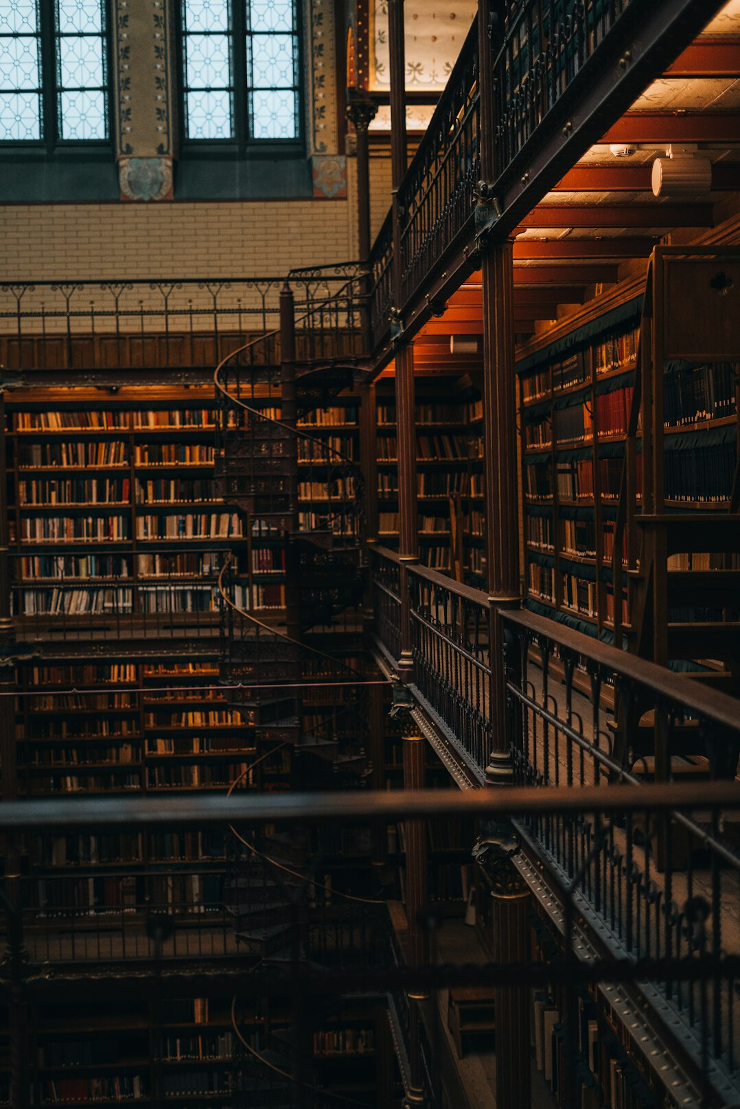 Interior of an old library with tall wooden bookshelves