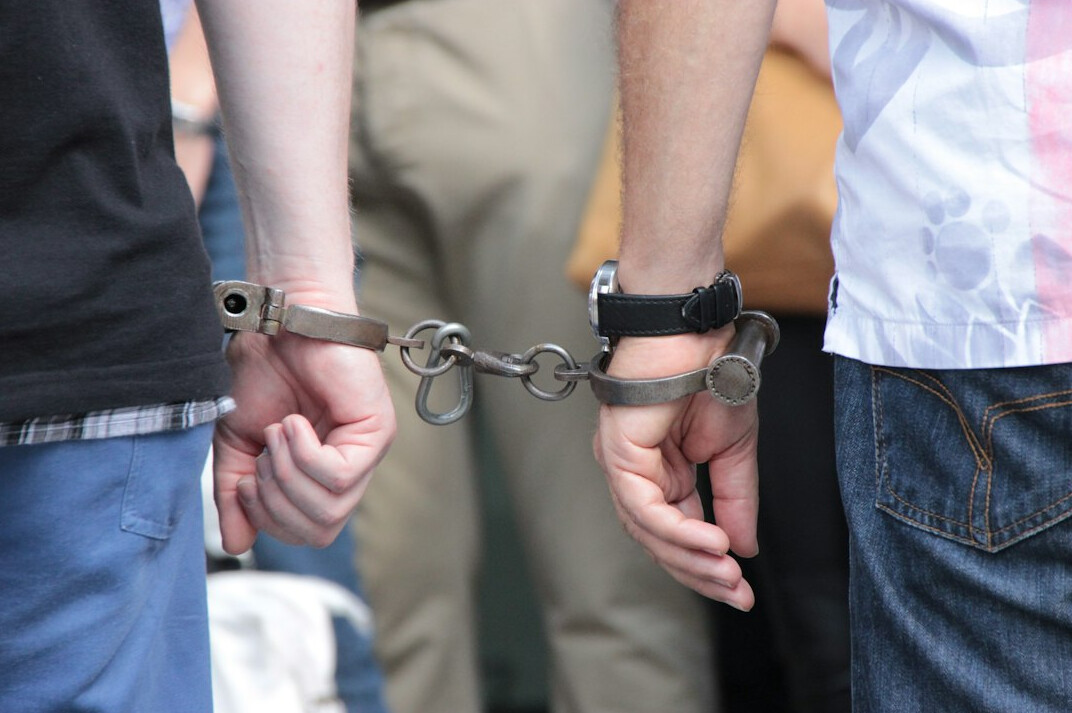 detective arresting shoplifter